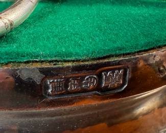 This lot features an antique Victorian silver plated wine coaster trolley made in Japan along with a sterling silver wine coaster by Frank Whiting & Co.