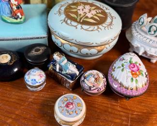 This lot features a large collection of antique jewelry and trinket boxes made from various materials by makers around the world.