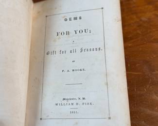 This lot features an antique book by author F. A. Moore titled, "Gems For You: A Gift For All Seasons", published by William H. Fisk circa 1851.