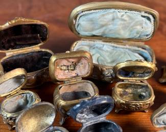 This lot features a large collection of Art Nouveau-style metal jewelry caskets or trinket boxes.