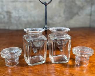 This lot features an antique silver-plated and crystal double pickle castor set, manufactured by Walker & Hall. Maker marks present underneath as shown in photos. Both inserts have minor chipping around the lid. This set measures, 10.25” H x 7.5” W x 4” D.