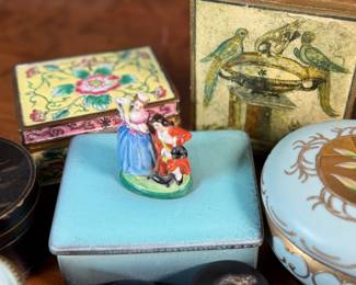 This lot features a large collection of antique jewelry and trinket boxes made from various materials by makers around the world.