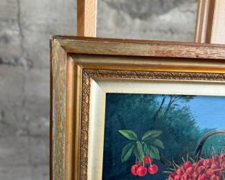 "Still Life With Cherries", an original oil on board and signed by artist, E.W. Troughton, circa 1907. This piece measures in frame, 19.25” H x 25.5” W.