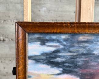 This lot features an original acrylic on board painting of a sunset seascape. No visible signature present. Measures in frame, 18.5” H x 23.5” W.