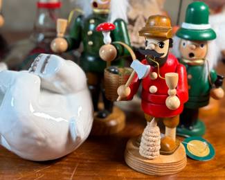 This lot features a large collection of traditional German incense smokers, also known as Räuchermännchen. Also, a decorative glass Christmas bottle and a porcelain bear manufactured by Royal Copenhagen. Maker mark present underneath as shown in photos.