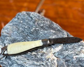 This lot features a pair of vintage pocket knives along with one being attached to a pocket knife chain, manufactured by H & H. Maker marks present as shown in photos.