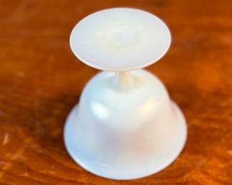 This lot features a Steuben Gold Aurene Calcite sherbet glass. This type of art glass was developed by Frederick Carder at the Steuben Glass Works in the early 1900s. This glass measures, 4” H x 4” W x 4” D and is in very good condition.