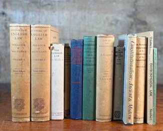 This lot features a collection of antique and vintage books, primarily on various types of law.