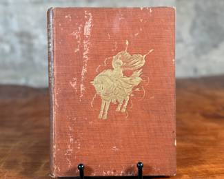 This lot features a rare edition of, "The Magic Horse and Other Stories from The Arabian Nights", retold by author Laurence Housman. This edition features drawings and illustrations by the notable artist, Edmund Dulac.