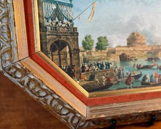 This lot features an Italian gilt wood frame with a print inside. This piece measures in frame, 13” H x 16” W.