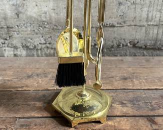 This lot features a mid-century fireplace tool set in excellent condition.