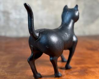 This lot features a vintage cast iron “cat” bank that measures, 7.5” H x 9” W x 3” D.