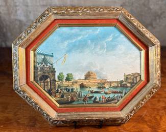 This lot features an Italian gilt wood frame with a print inside. This piece measures in frame, 13” H x 16” W.