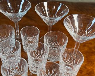 This lot features a wonderful collection of fourteen (14) pieces of Waterford Crystal. All pieces bear the maker mark underneath as shown in photos and appear to be in very good condition.