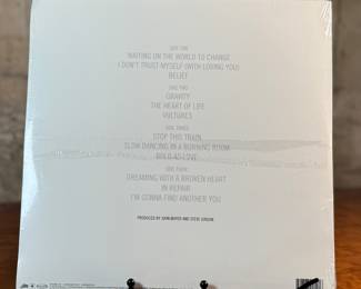 This lot features a sealed vinyl record of the album, Continuum by artist, John Mayer. It is the artist’s third studio album, released in 2006. The album is a 180-gram double vinyl pressing. It includes hit songs like "Waiting on the World to Change" and "Gravity".