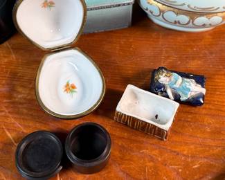 This lot features a large collection of antique jewelry and trinket boxes made from various materials by makers around the world.