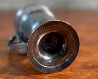 This lot features a 1873 birth commemorative sterling silver footed cup retailed by Ohio jeweler & silversmith, William Wilson McGrew (1833-1893). This silver cup was made to commemorate the birth of Nathaniel Foster Wilshire, son of George Wilshire who was a railroad and business tycoon. This cup measures, 5.25” H x 2.75” W x 4” D with a total approx. weight of 176.61 grams. Maker marks present underneath as shown in photos.