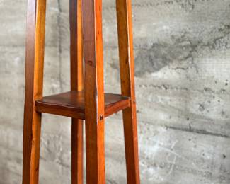 This lot features a modern three-tier shelving unit that measures, 60” H x 15” W x 15” D.