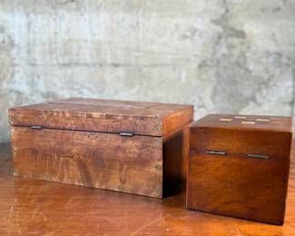 This lot features a pair of 19th century wooden boxes in good overall condition given their age. The largest measures, 5.25” H x 10.75” W x 5.75” D.