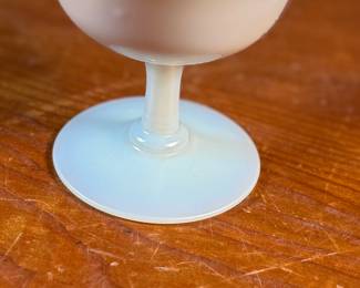 This lot features a Steuben Gold Aurene Calcite sherbet glass. This type of art glass was developed by Frederick Carder at the Steuben Glass Works in the early 1900s. This glass measures, 4” H x 4” W x 4” D and is in very good condition.