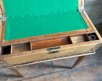 This lot features an incredible 19th century Italian travel desk on a wooden stand. The travel desk is removable and features numerous drawers and compartments inside. This piece measures (on the stand), 26” H x 20” W x 11” D.