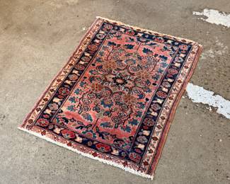 This lot features a Persian Sarouk rug that measures, 32” H x 22.5” W.