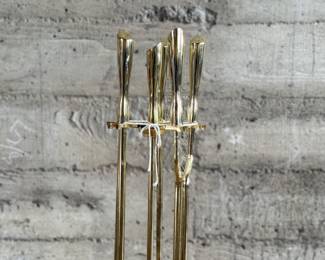 This lot features a mid-century fireplace tool set in excellent condition.