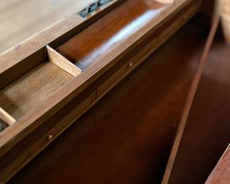 This lot features an incredible 19th century Italian travel desk on a wooden stand. The travel desk is removable and features numerous drawers and compartments inside. This piece measures (on the stand), 26” H x 20” W x 11” D.