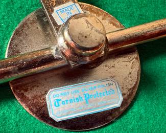 This lot features an antique Victorian silver plated wine coaster trolley made in Japan along with a sterling silver wine coaster by Frank Whiting & Co.
