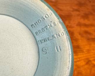 This lot features a collection of antique pottery including a piece marked by Wedgwood and another by Dudson Brothers of England. Dudson Brothers is a historic British pottery company founded in 1800 by Richard Dudson in Stoke-on-Trent, England. Wedgwood history began in 1759 when Josiah Wedgwood founded the company in Staffordshire, England, and is renowned for his innovative pottery, marketing, and manufacturing techniques.