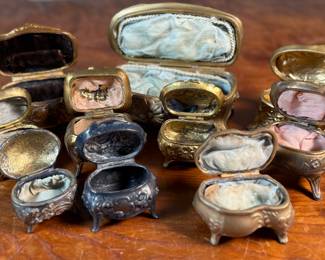 This lot features a large collection of Art Nouveau-style metal jewelry caskets or trinket boxes.