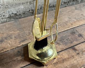 This lot features a mid-century fireplace tool set in excellent condition.