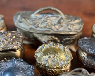 This lot features a large collection of Art Nouveau-style metal jewelry caskets or trinket boxes.