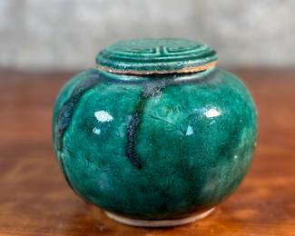 This lot features an antique Chinese green-glazed pottery ginger jar. Originally used for storing spices and herbs, the tradition of ginger jars dates back to China’s Qin dynasty. This jar measures, 4.5” H x 5.5” W x 5.5” D.