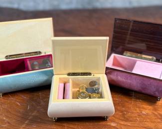This lot features three (3) music boxes, all manufactured by The San Francisco Music Box Company. All three are in good overall condition with maker mark present underneath as shown in photos.