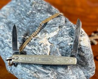 This lot features a pair of vintage pocket knives along with one being attached to a pocket knife chain, manufactured by H & H. Maker marks present as shown in photos.