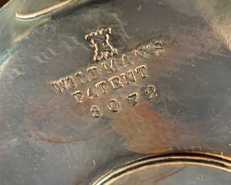 This lot features a Victorian cruet set, manufactured by Wildman’s. Maker marks present underneath as shown in photos. This cruet set measures, 10” H x 7” W x 7” D.