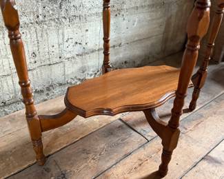 This lot features a solid wood oval shaped parlor table that measures, 29” H x 30” W x 20” D.