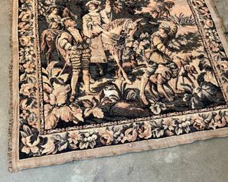 This lot features a French Aubusson-style wall tapestry, likely a handwoven replica of a 17th-century historical tapestry. This piece measures, 48” H x 48” W.
