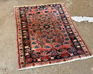 This lot features a Persian Sarouk rug that measures, 32” H x 22.5” W.
