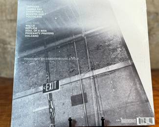 This lot features a sealed vinyl record for the album Modern Guilt by American musician, Beck. This record was co-produced by Beck and Danger Mouse. This is also the 180-gram virgin vinyl edition that includes a bonus download of the entire album in MP3 format.