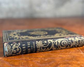 This lot features an antique book by author F. A. Moore titled, "Gems For You: A Gift For All Seasons", published by William H. Fisk circa 1851.