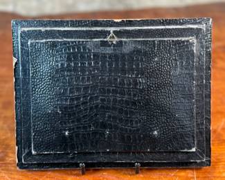 This lot features an antique embroidery cross stitch work of art, measures in frame, 8” H x 10” W.