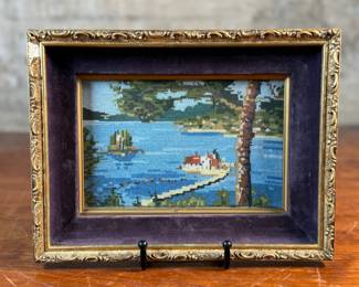 This lot features an antique embroidery cross stitch work of art, measures in frame, 8” H x 10” W.