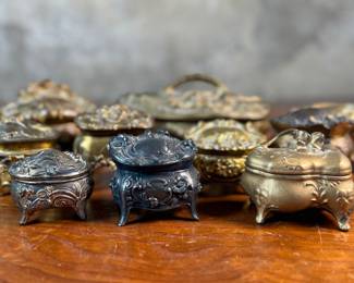 This lot features a large collection of Art Nouveau-style metal jewelry caskets or trinket boxes.