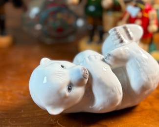 This lot features a large collection of traditional German incense smokers, also known as Räuchermännchen. Also, a decorative glass Christmas bottle and a porcelain bear manufactured by Royal Copenhagen. Maker mark present underneath as shown in photos.