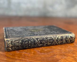 This lot features an antique hardcover book of, "The Lily of the Valley", edited by Elizabeth Doten circa 1854.