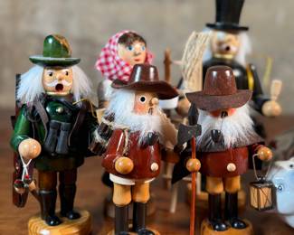 This lot features a large collection of traditional German incense smokers, also known as Räuchermännchen. Also, a decorative glass Christmas bottle and a porcelain bear manufactured by Royal Copenhagen. Maker mark present underneath as shown in photos.