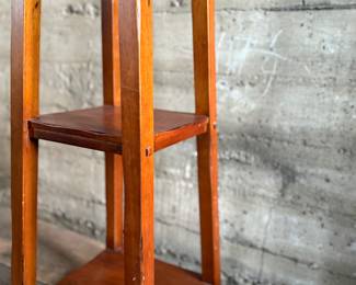 This lot features a modern three-tier shelving unit that measures, 60” H x 15” W x 15” D.