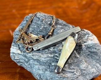 This lot features a pair of vintage pocket knives along with one being attached to a pocket knife chain, manufactured by H & H. Maker marks present as shown in photos.